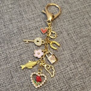 Multiple Gold Charm Bag Charm with Red and Pink Accents